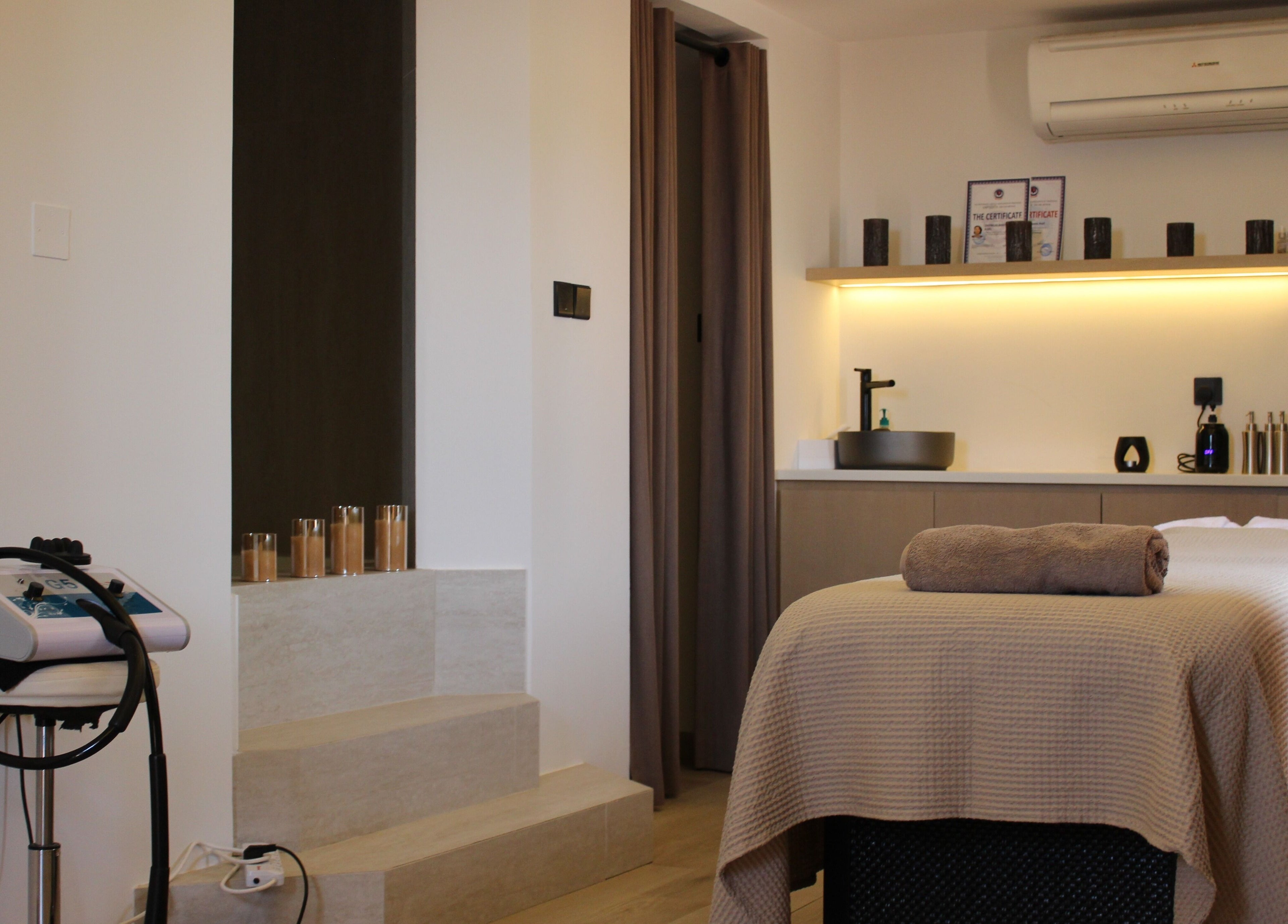 Tranquil spa room at By Mikas Beauty Salon - Sole Proprietorship L.L.C., Abu Dhabi, Abu Dhabi, AE, with massage table.