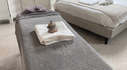 Massage bed with stones at Your Home (Home Visit), Warlingham, England, GB for ultimate relaxation.