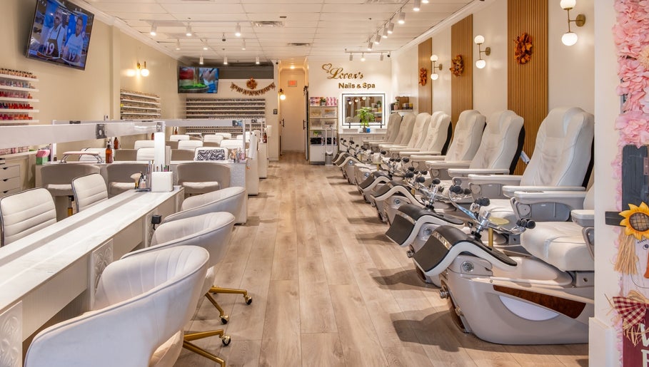 Interior of Lover's Nails Spa Kissimmee, Florida featuring luxurious pedicure chairs and modern decor.