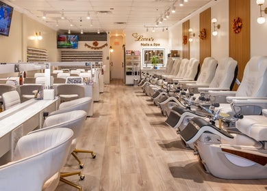 Interior of Lover's Nails Spa Kissimmee, Florida featuring luxurious pedicure chairs and modern decor.