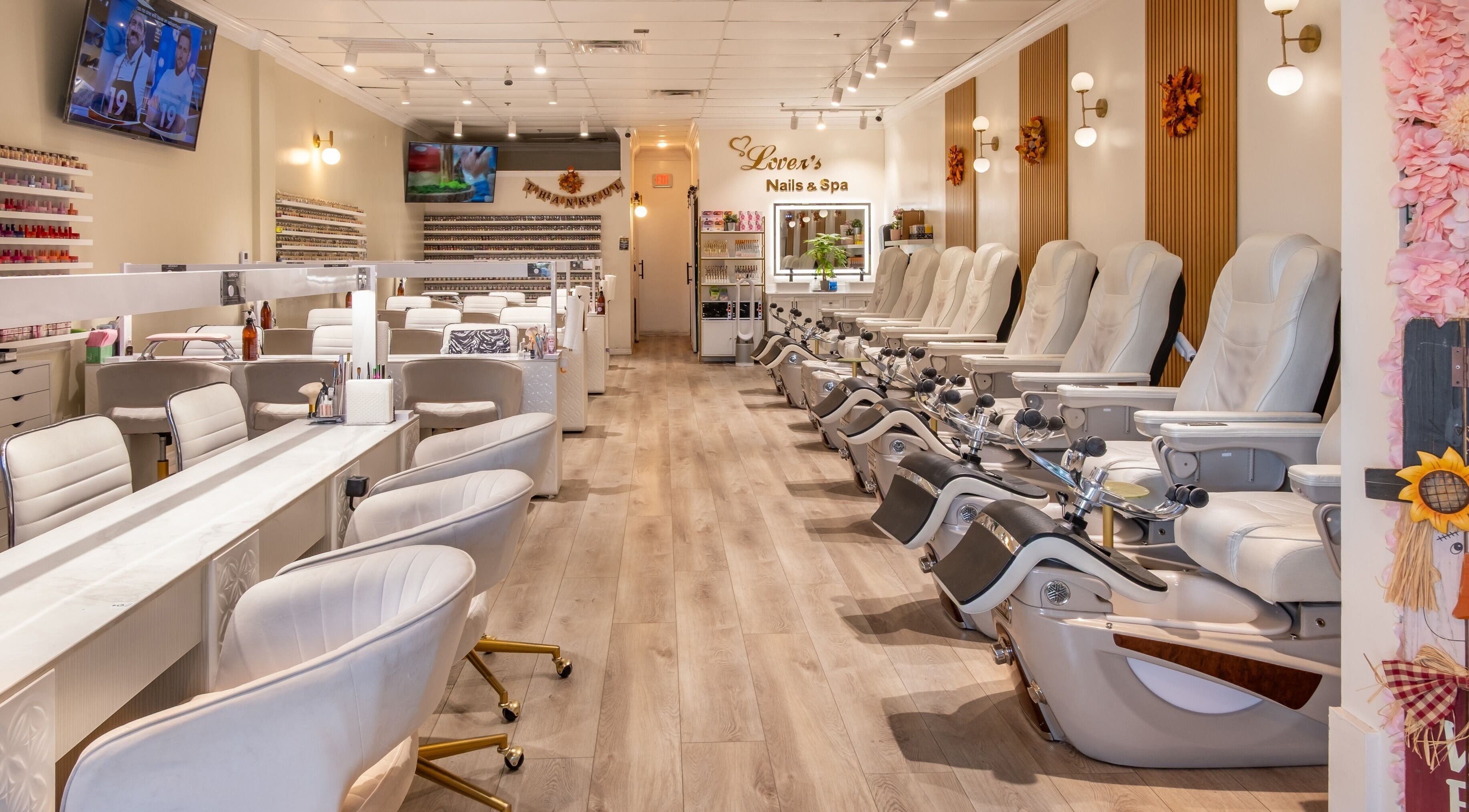 Interior of Lover's Nails Spa Kissimmee, Florida featuring luxurious pedicure chairs and modern decor.