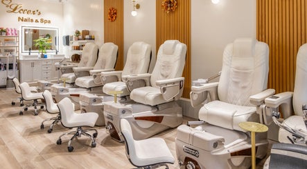 Elegant pedicure stations at Lover's Nails Spa Kissimmee, Kissimmee, Florida, US offer a luxurious ambiance.