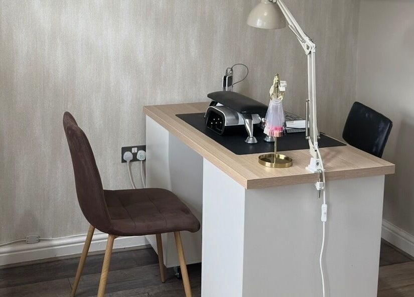 Modern nail table setup at Ashton Artistry in Brandon, England, GB, featuring sleek design and efficient lighting.