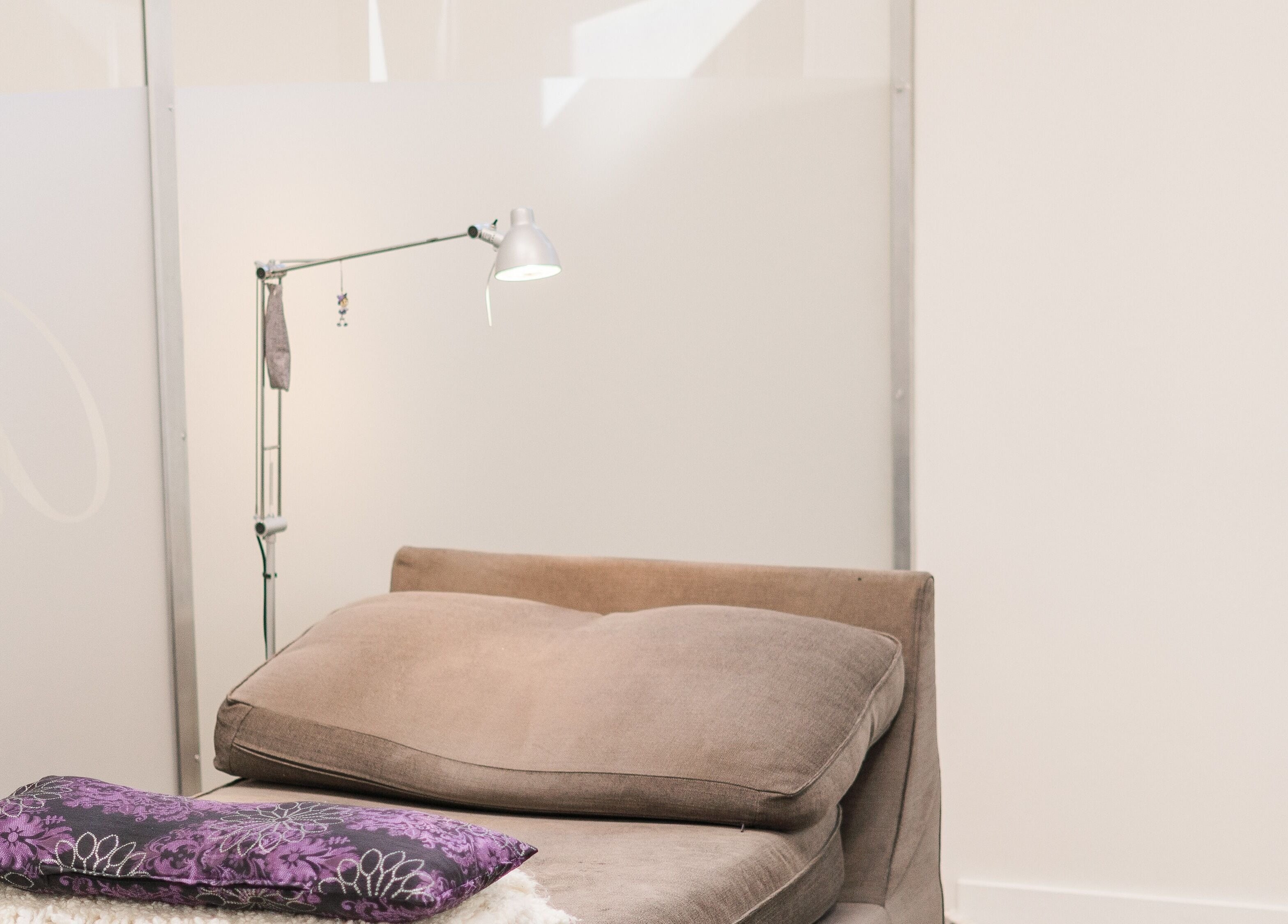 Elegant lash lounge at Bizou Lash Studio, Sherwood Park, Alberta, CA, featuring a plush chair and unique lighting.