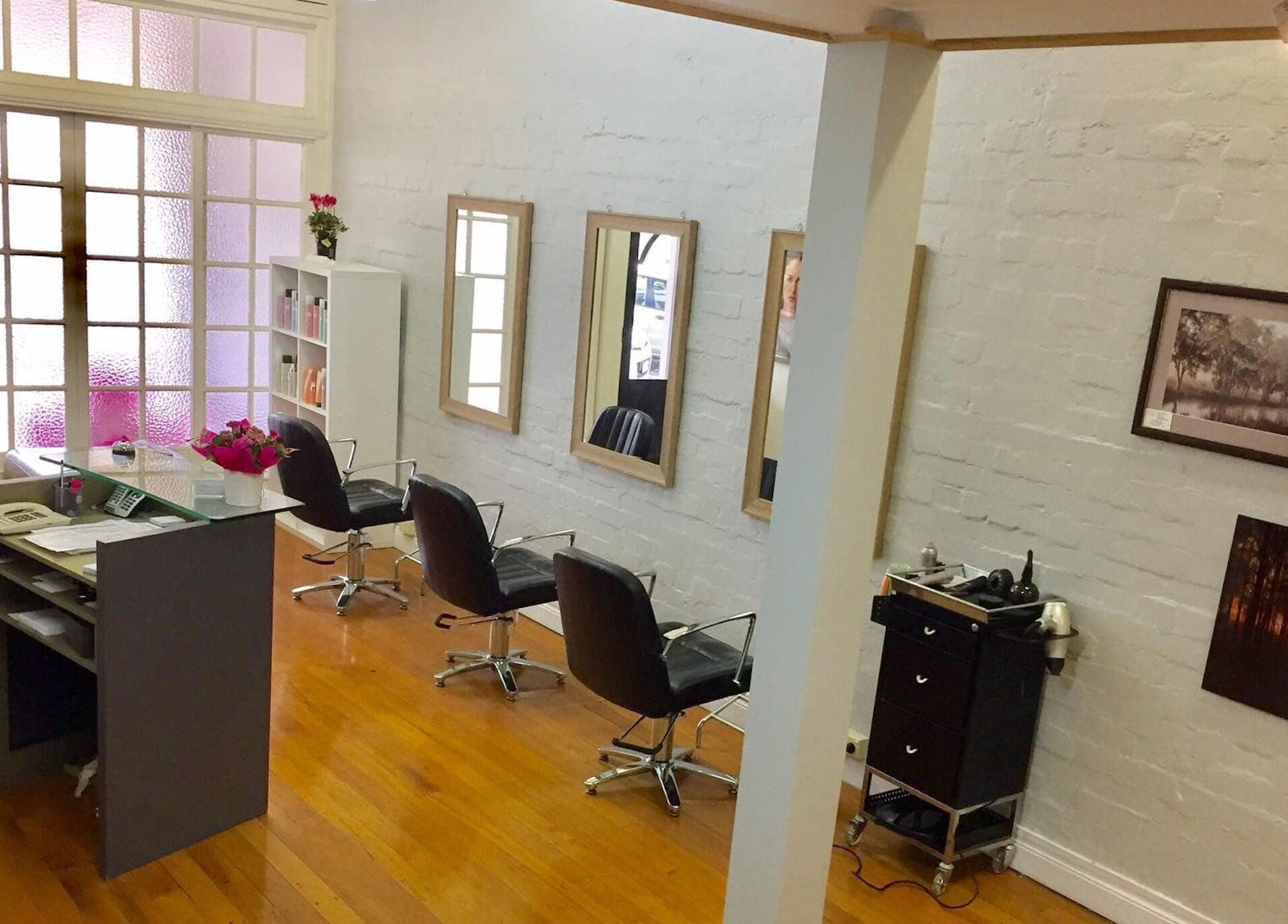 Elegant interior of Salon at 72 in Warwick, Queensland, AU featuring mirrors and chairs.