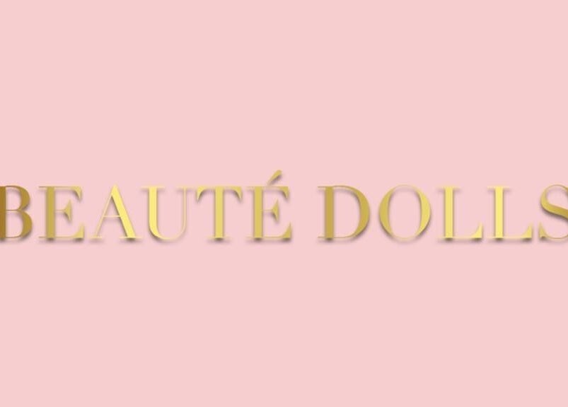 Beautè Dolls logo in gold on a pink background, Luton, England, GB.