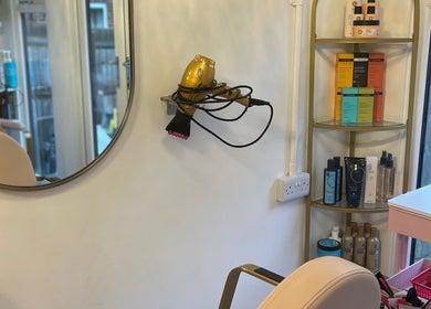 Modern beauty station with products at Beautè Dolls, Luton, England, GB showcasing elegance and style.