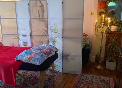 Calming therapy room at ReflexiveSole Holistic Therapies in Weston-super-Mare, England, GB with Buddha decor.