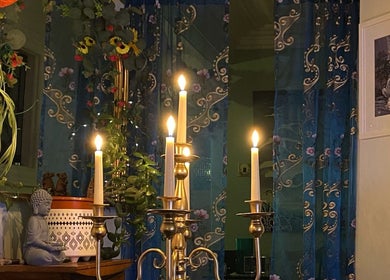 Tranquil candlelit setting at ReflexiveSole Holistic Therapies, Weston-super-mare, England, GB with calming decor.