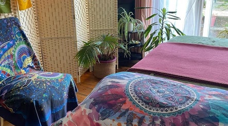 Relaxing therapy room with colorful textiles at ReflexiveSole Holistic Therapies, Weston-super-mare, England, GB.