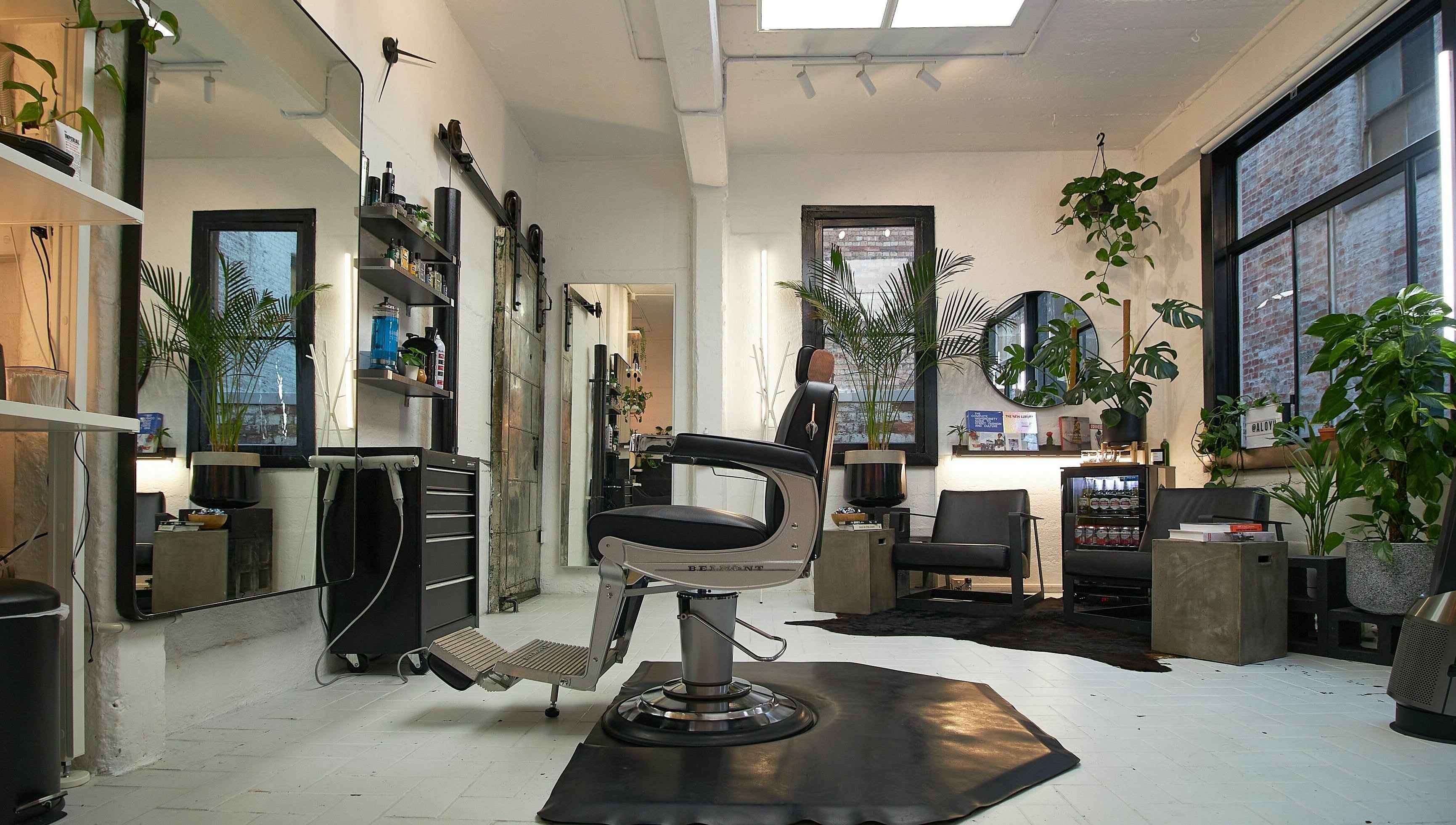 Modern salon interior at Aloyh Studio, East Melbourne, Victoria, AU, featuring stylish decor and comfortable seating.
