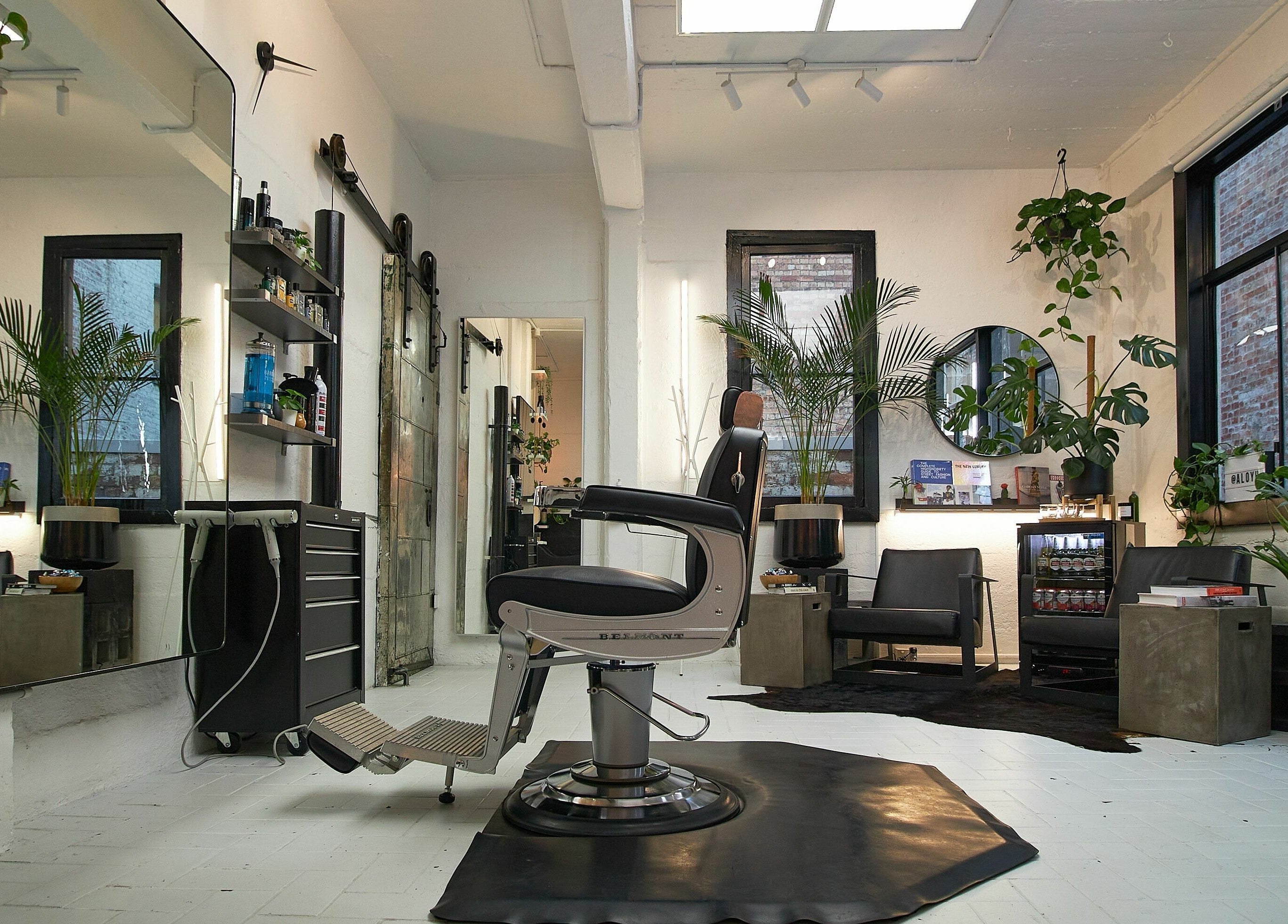 Modern salon interior at Aloyh Studio, East Melbourne, Victoria, AU, featuring stylish decor and comfortable seating.