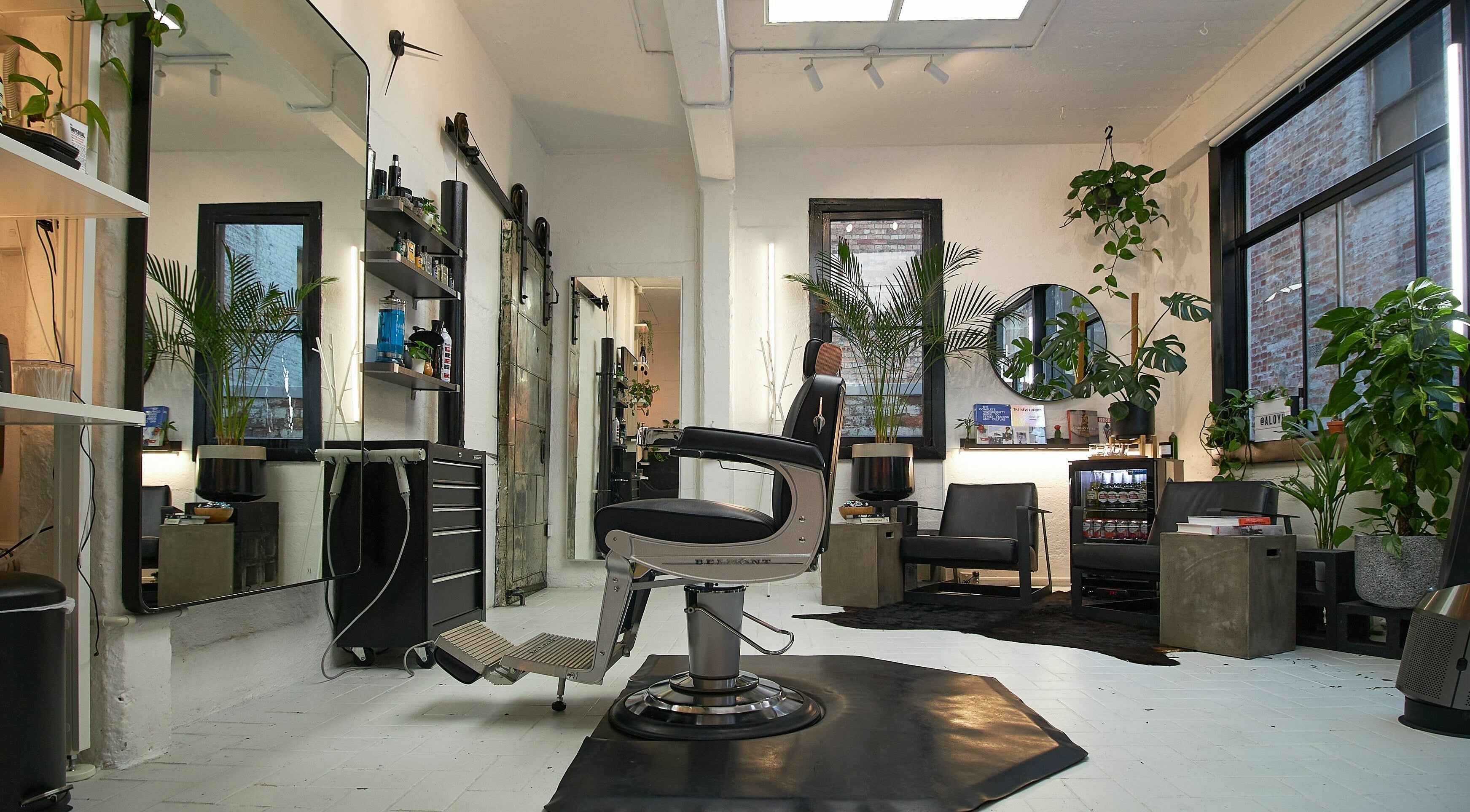 Modern salon interior at Aloyh Studio, East Melbourne, Victoria, AU, featuring stylish decor and comfortable seating.