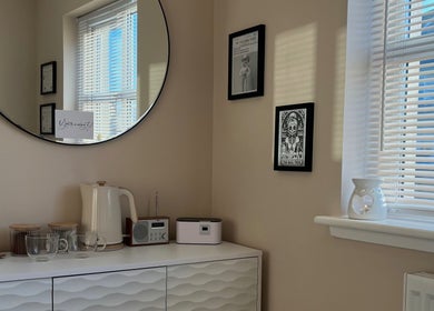 Sophisticated interior of Braw Nails, Livingston, Scotland, GB showcasing a stylish mirror and elegant decor.