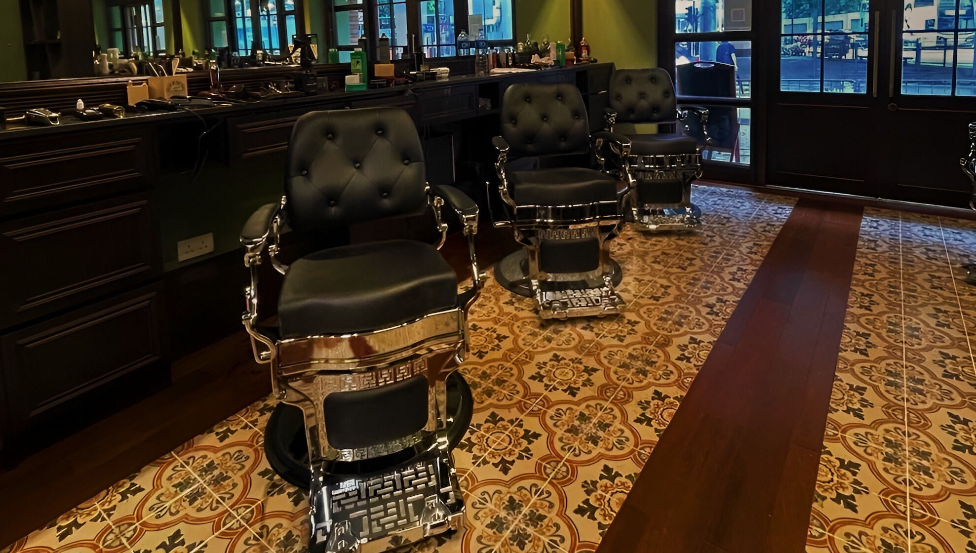 Luxurious barber chairs at The Suns Barbershop, 香港島, 香港島, HK, featuring ornate flooring.