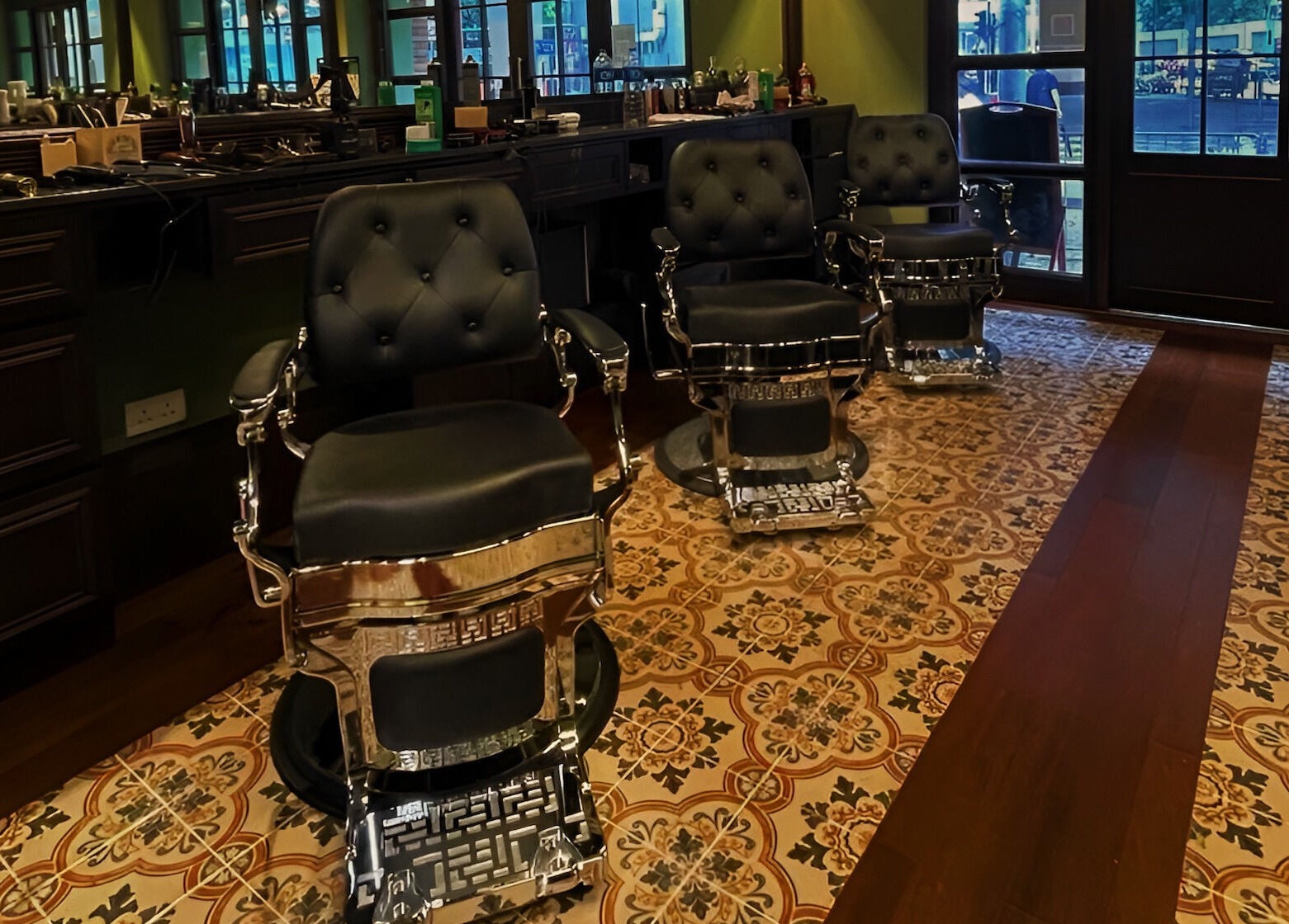 Luxurious barber chairs at The Suns Barbershop, 香港島, 香港島, HK, featuring ornate flooring.