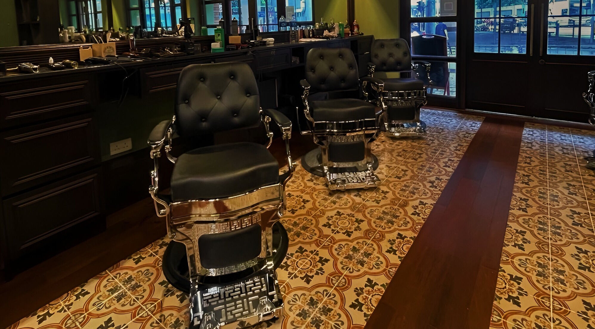 Luxurious barber chairs at The Suns Barbershop, 香港島, 香港島, HK, featuring ornate flooring.