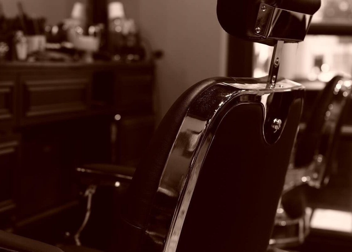 Vintage barber chair at The Suns Barbershop, 香港島, 香港島, HK, showcasing timeless barbering style.