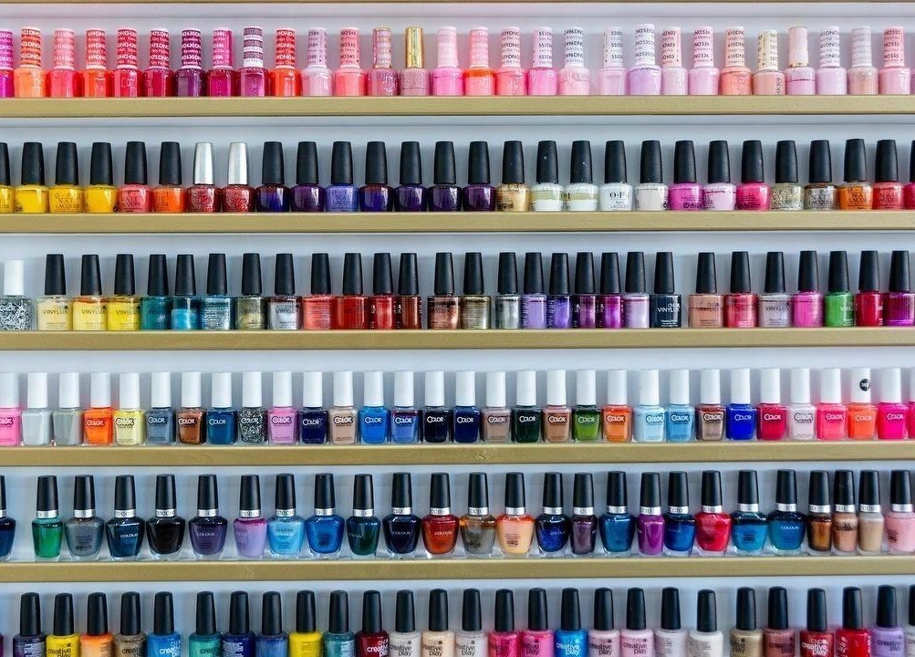 Vibrant nail polish selection at Regal Nails, Croydon, England, GB, showcasing a rainbow of colors.