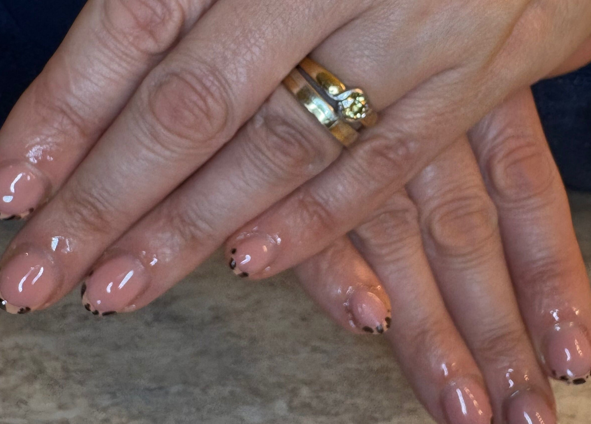 Beautifully manicured hands at KatieBea Beauty, Dundee, Scotland, GB, showcasing intricate nail art.