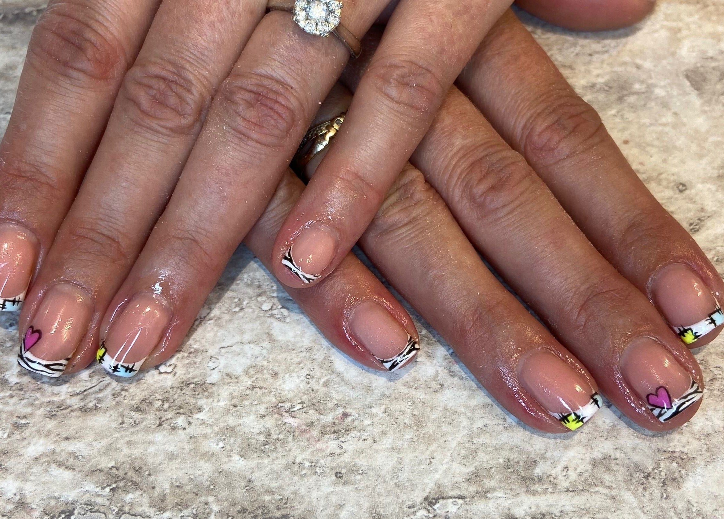 Creative nail art design at KatieBea Beauty in Dundee, Scotland, GB, showcasing intricate patterns and color.