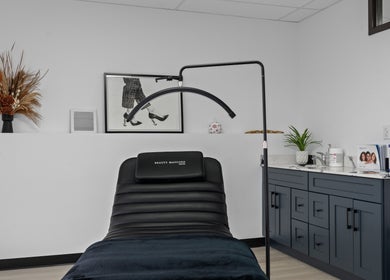 Relaxing treatment room at Beauty Matched Med Spa, Sarnia, Ontario, CA with modern decor and comfortable seating.