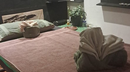 Relaxing spa table setup at Body & Soul Thai Day Spa, Randburg, Gauteng, ZA, with towels and decor.