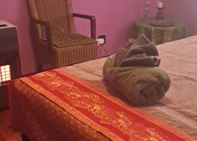 Comfortable massage room at Body & Soul Thai Day Spa, Randburg, Gauteng, ZA, with a warm ambiance.