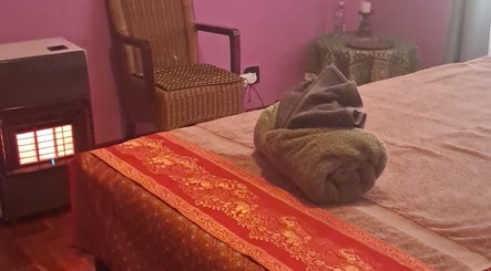 Comfortable massage room at Body & Soul Thai Day Spa, Randburg, Gauteng, ZA, with a warm ambiance.