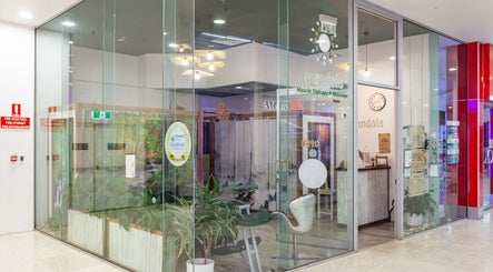 Entrance of Mandala Muscle Therapy and Massage in Tweed Heads South, New South Wales, AU through glass doors.