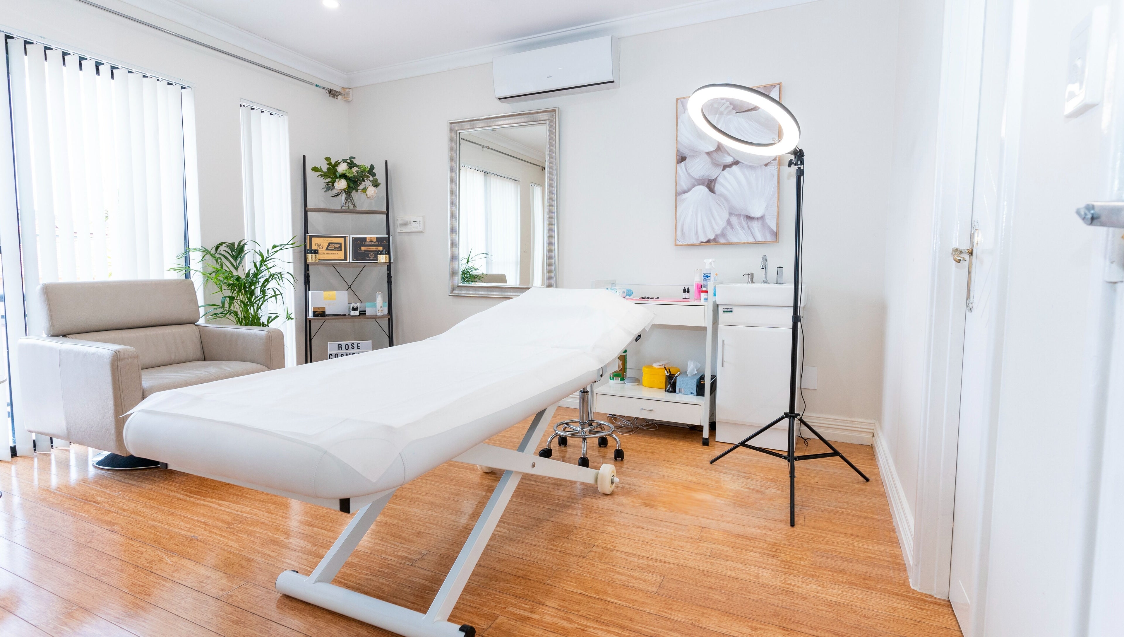 Spacious treatment room at Rose Clinic, North Perth, Western Australia, featuring a comfortable bed and stylish decor.
