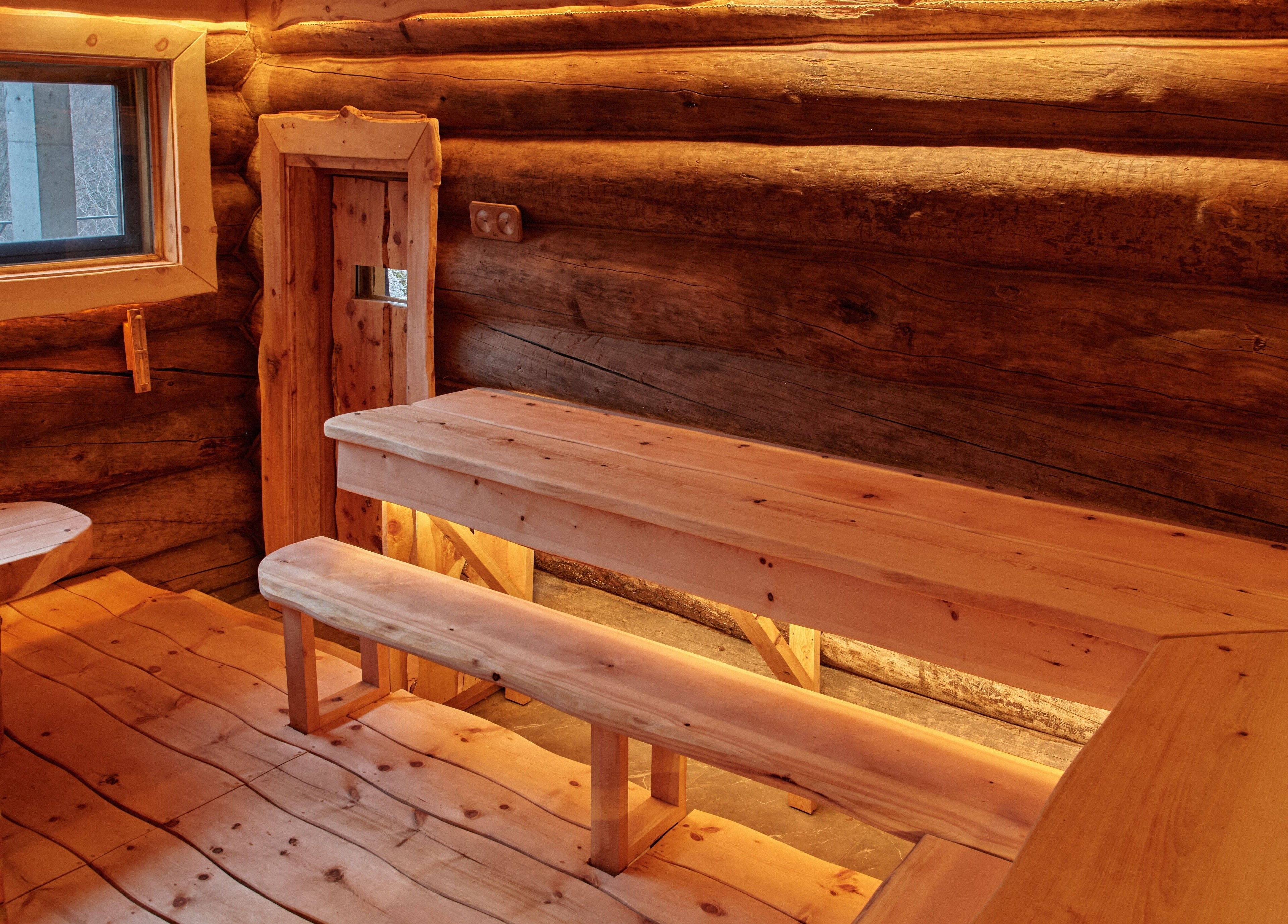Warm wooden interior of Banya No.1 Tbilisi Private, a serene sauna in Kiketi, GE, featuring handcrafted benches.