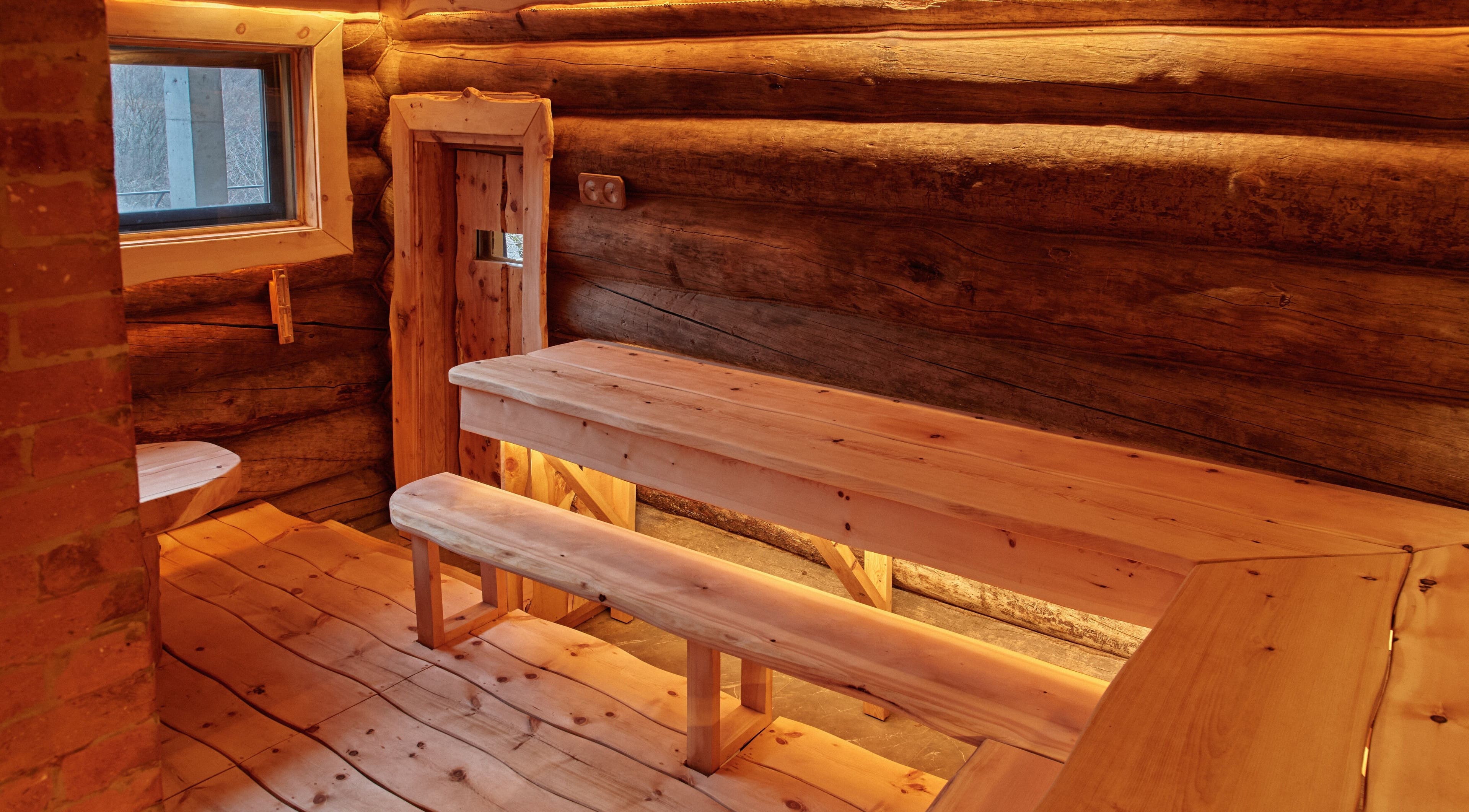Warm wooden interior of Banya No.1 Tbilisi Private, a serene sauna in Kiketi, GE, featuring handcrafted benches.