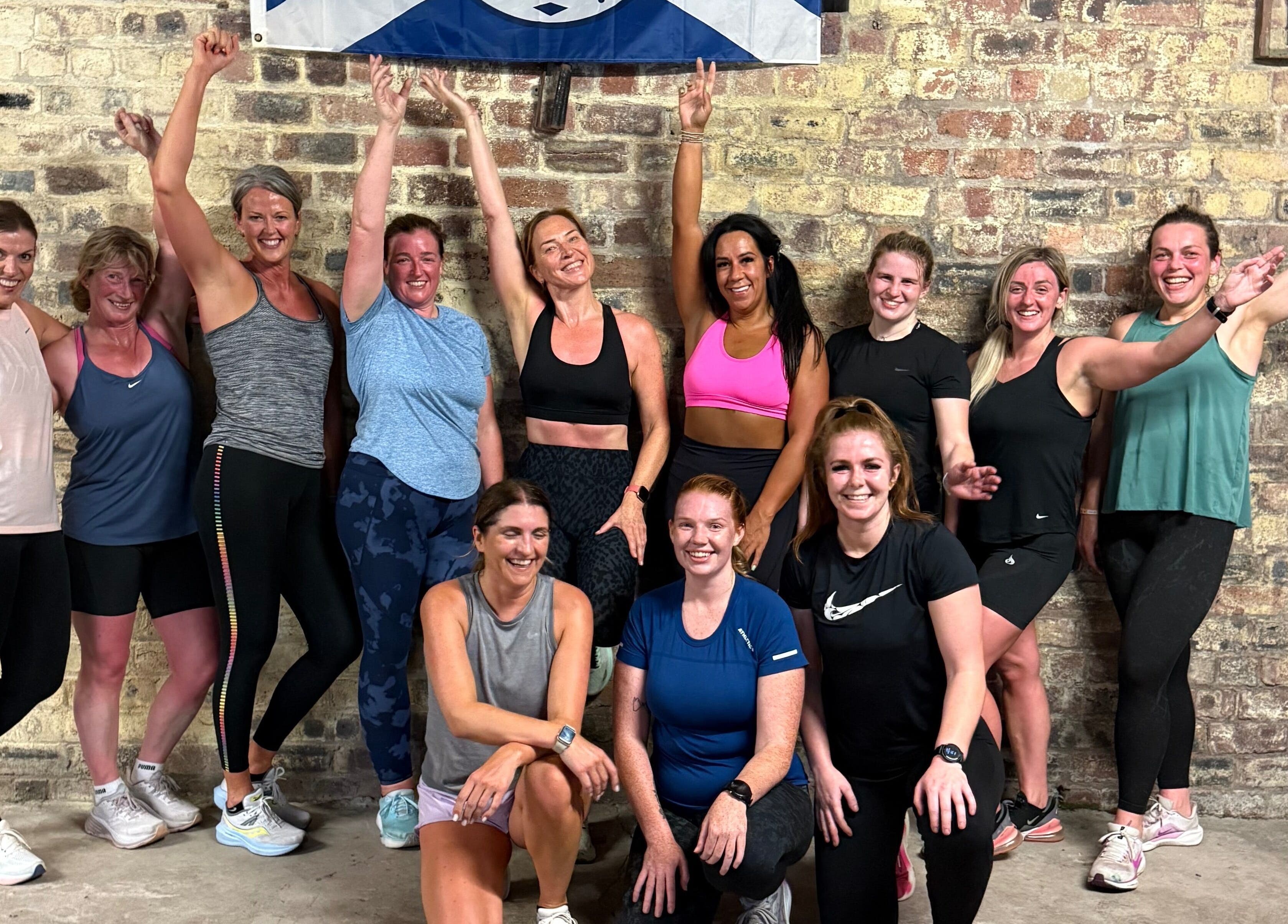 Group of women celebrating after a workout at Keep Moving Forward, Dumfries, Scotland, GB.