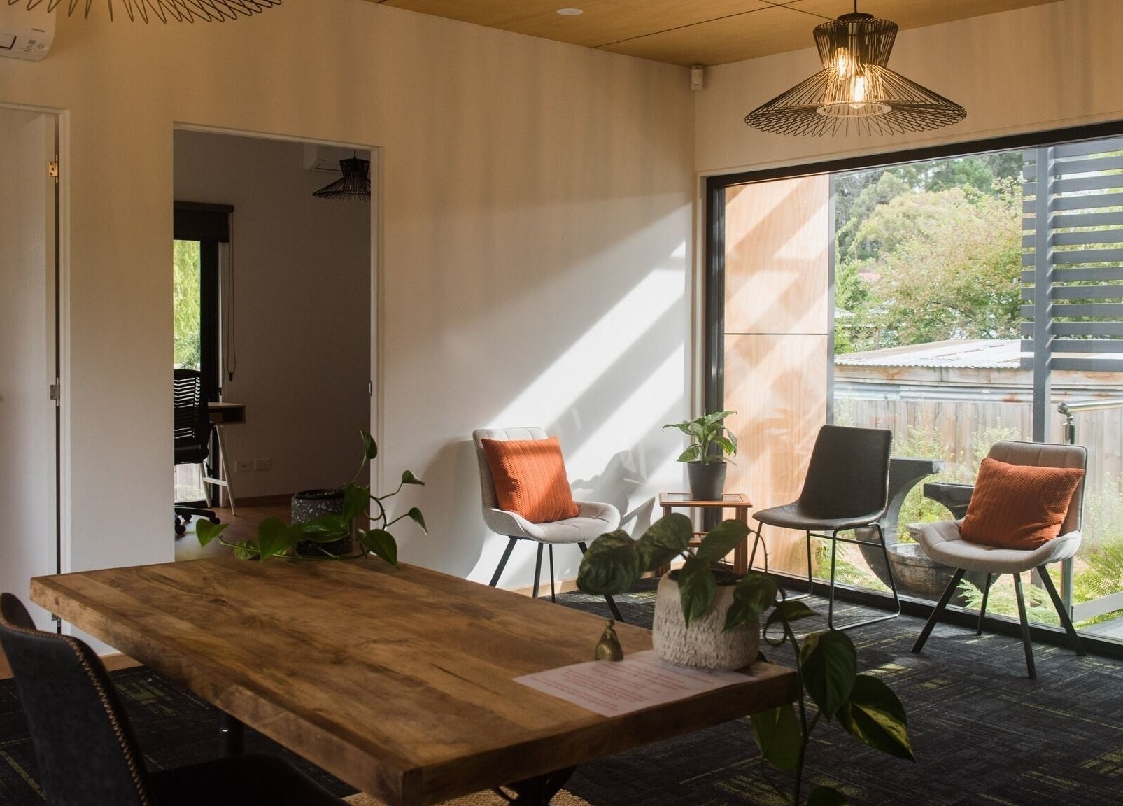 Inviting seating area at Wildheart Healing, Cygnet, Tasmania, AU with natural light and elegant decor.