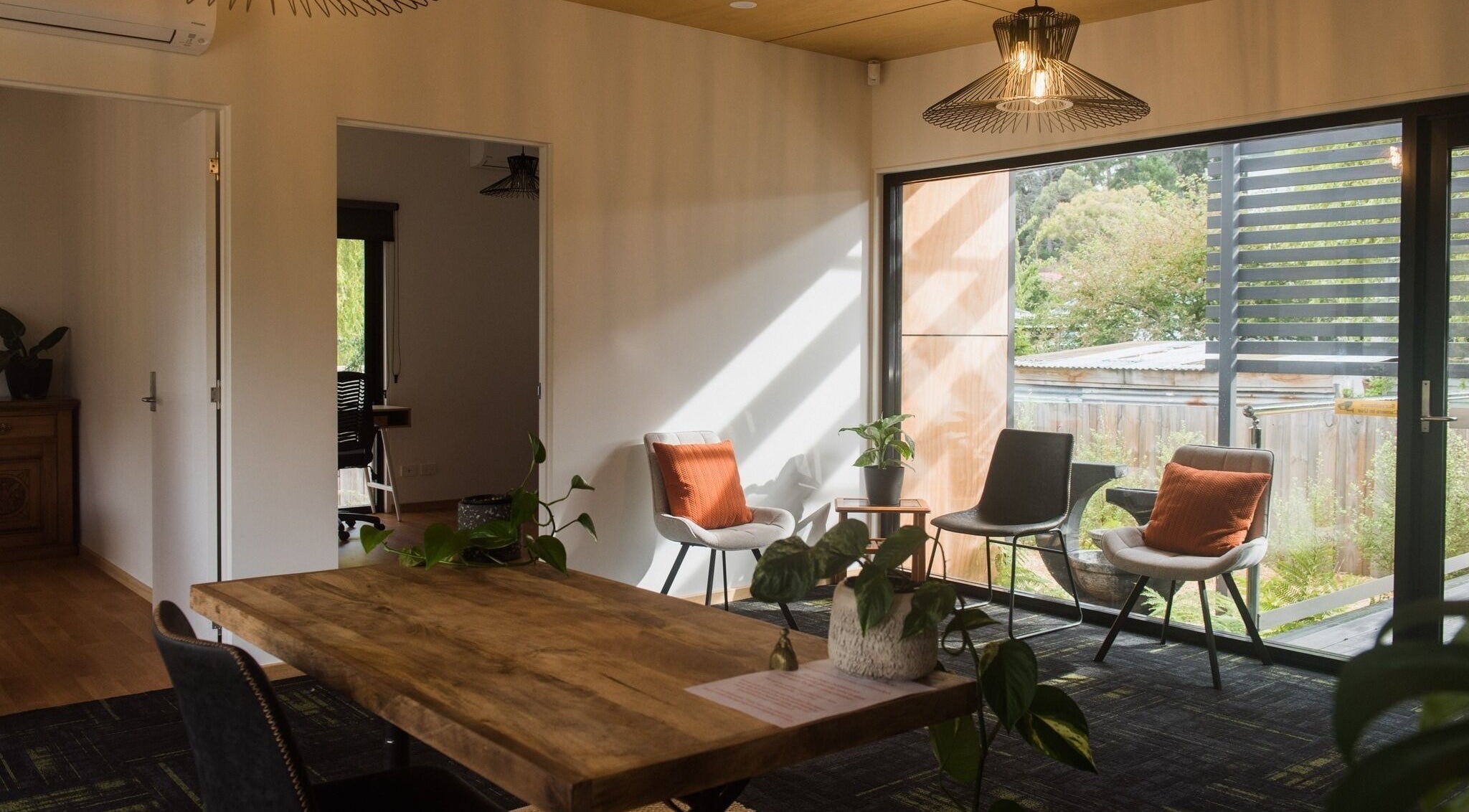 Inviting seating area at Wildheart Healing, Cygnet, Tasmania, AU with natural light and elegant decor.