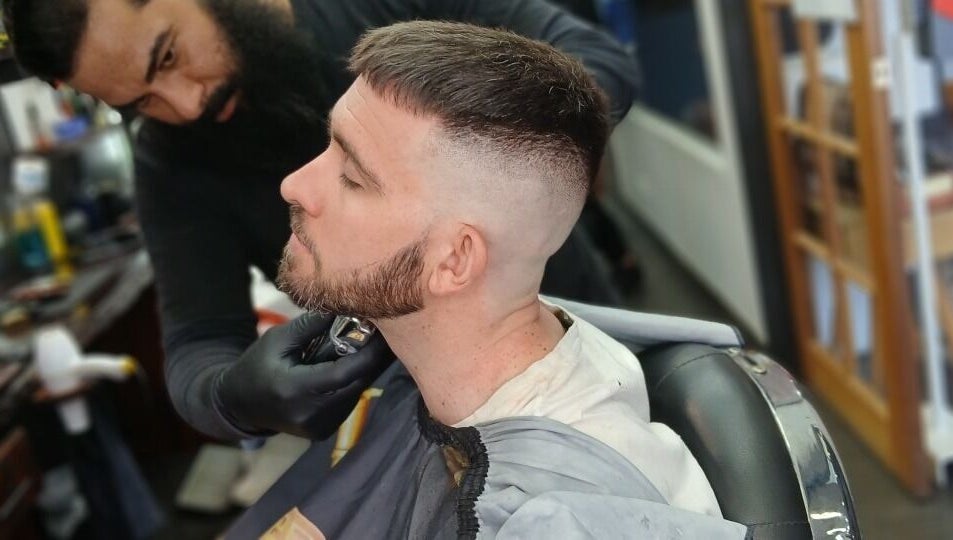 Skilled barber crafting a precise cut at Prestige Barber Lounge Caversham, Caversham, Western Australia, AU.