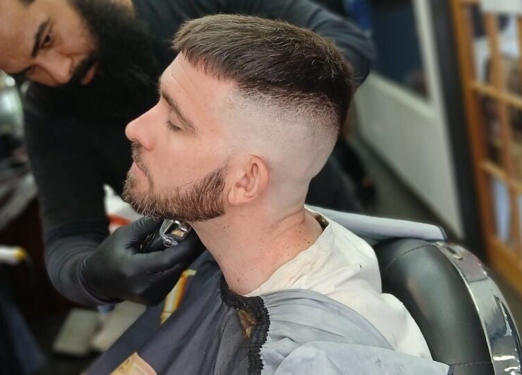 Skilled barber crafting a precise cut at Prestige Barber Lounge Caversham, Caversham, Western Australia, AU.