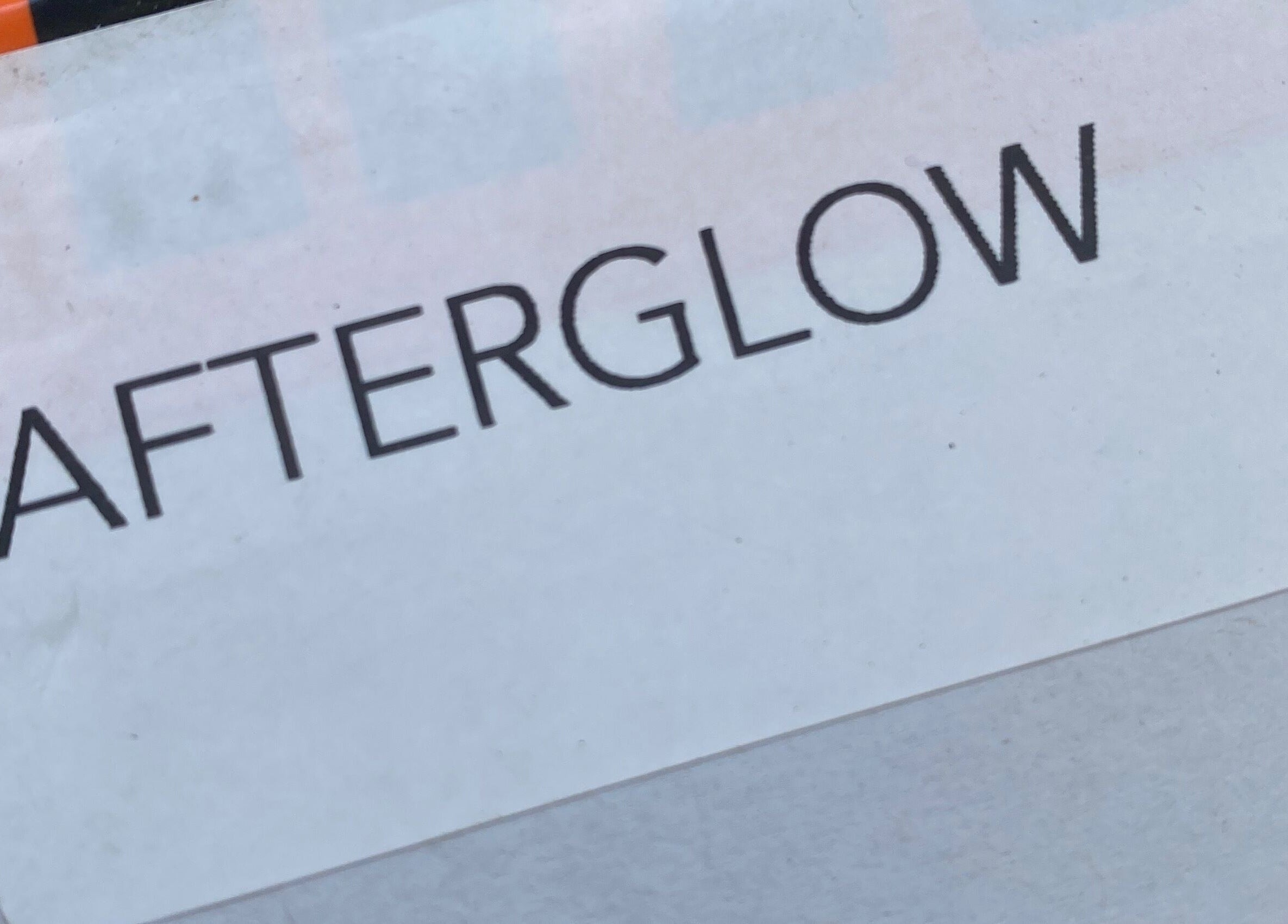Sign displaying 'Afterglow Skin & Tan', located in Kerikeri, Northland, NZ, highlighting beauty services.
