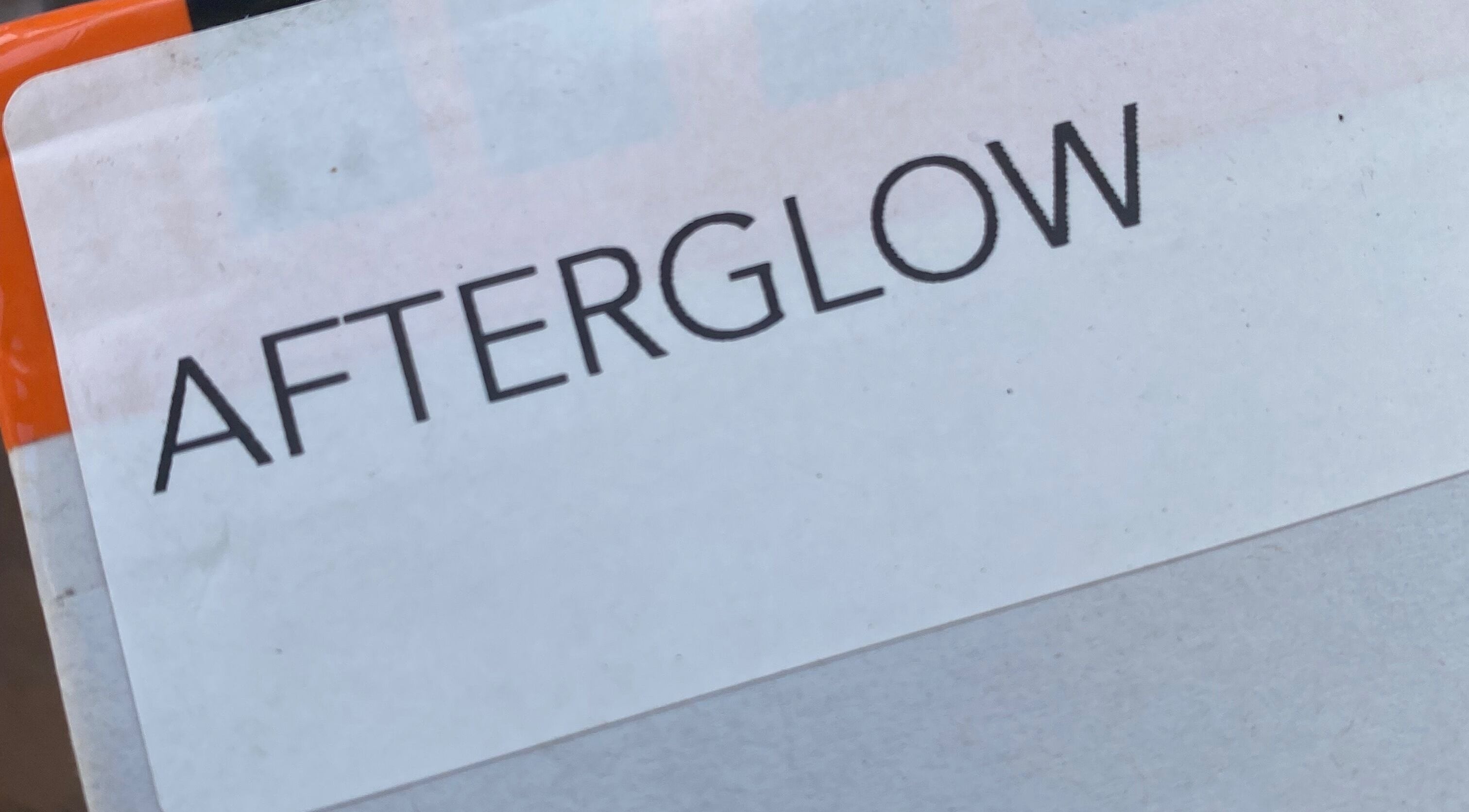 Sign displaying 'Afterglow Skin & Tan', located in Kerikeri, Northland, NZ, highlighting beauty services.