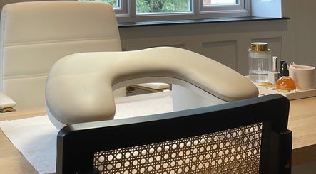 Cozy nail station setup at Nail by Lils, Tamworth, England, GB, featuring comfortable seating and nail care products.