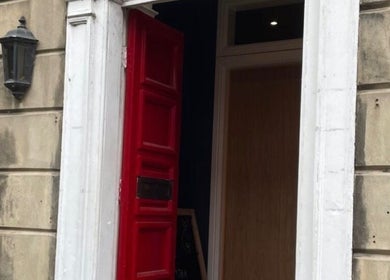 Charming red door entrance at Nail by Lils, Tamworth, England, GB.