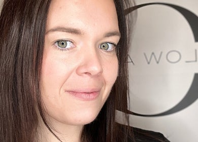 Professional at Glow Aesthetics by Chloe, Northampton, England, GB, smiling confidently at the camera.