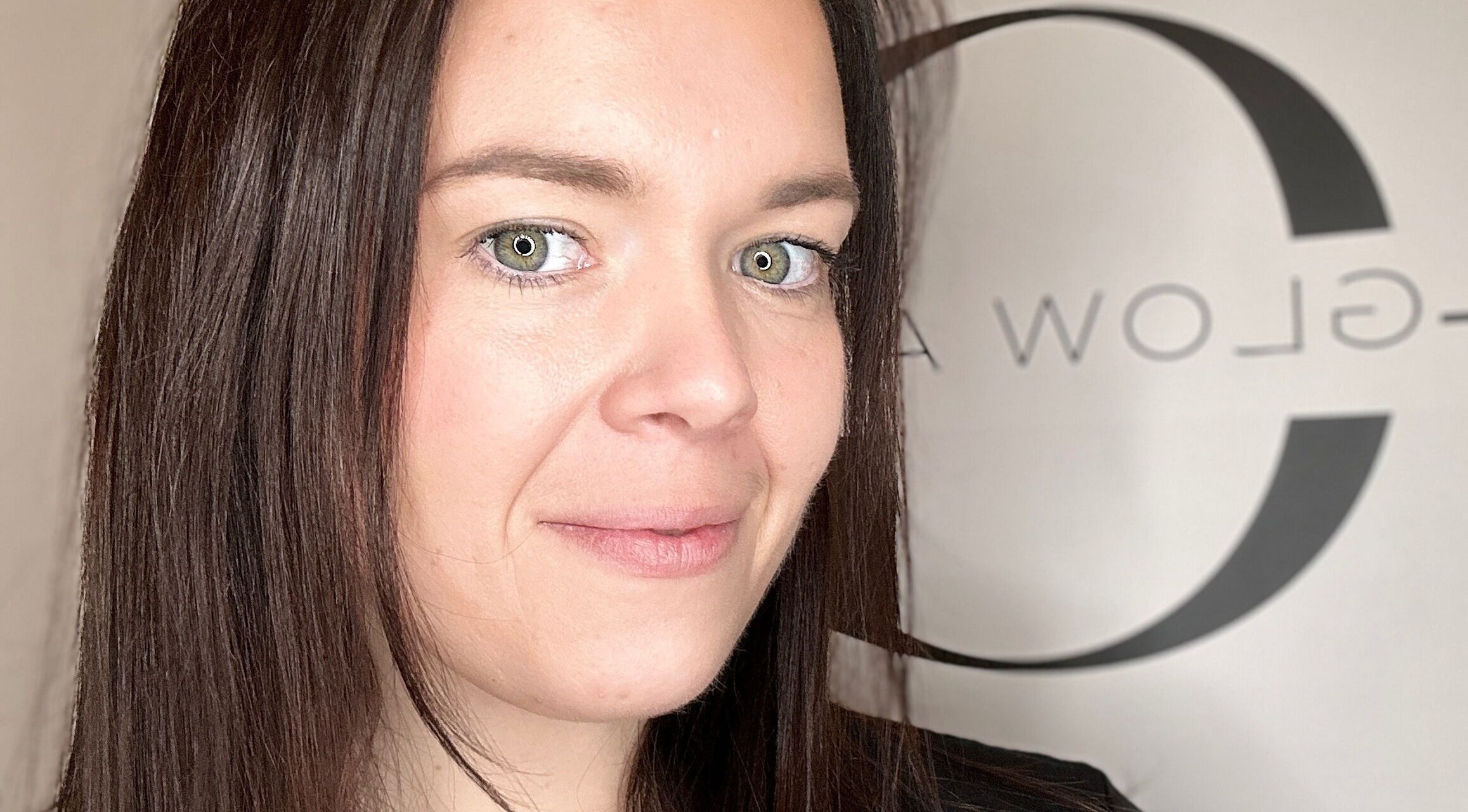 Professional at Glow Aesthetics by Chloe, Northampton, England, GB, smiling confidently at the camera.