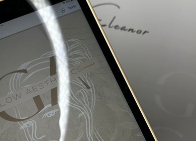 Glow Aesthetics by Chloe logo displayed on a tablet at Northampton, England, GB.