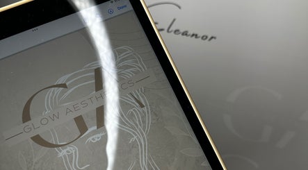 Glow Aesthetics by Chloe logo displayed on a tablet at Northampton, England, GB.