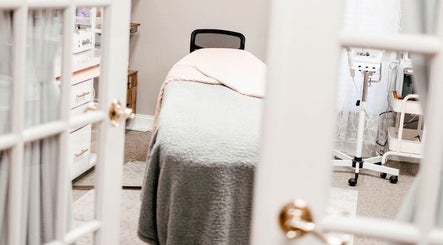 Relaxing treatment room at Pb Beauty Bar in Mooresville, North Carolina, US, featuring a cozy treatment bed.