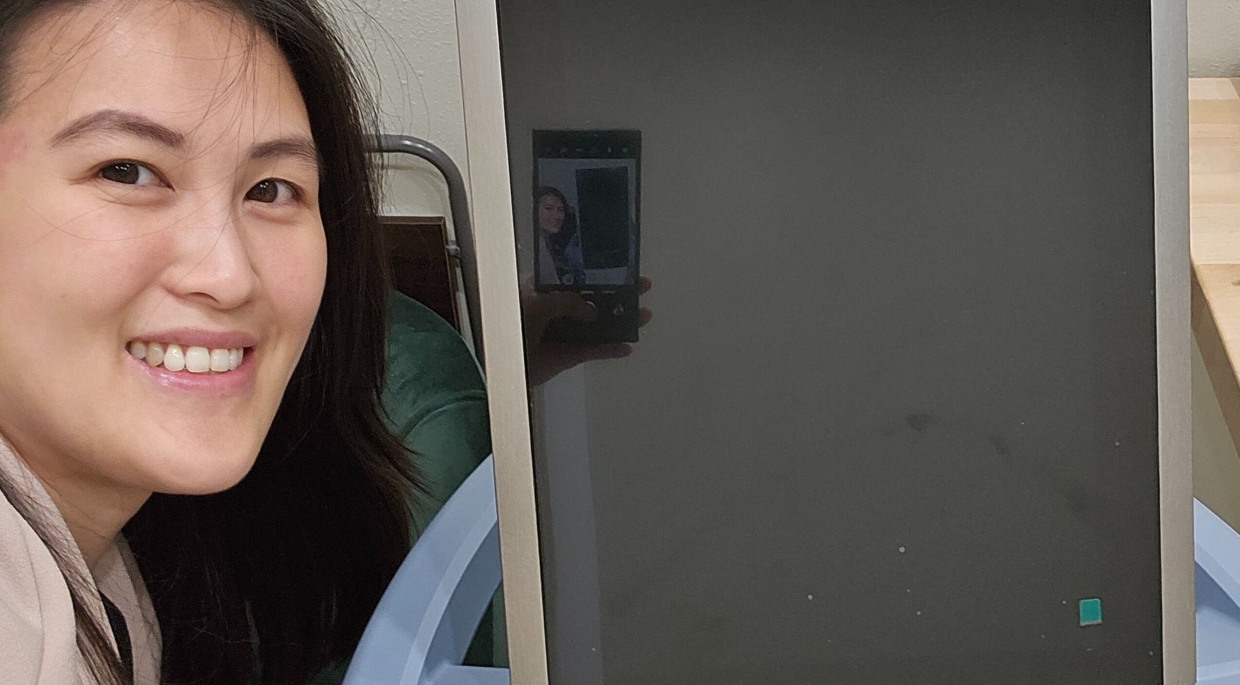 Smiling person beside equipment at Full Circle Aesthetics in Spokane Valley, Washington, US.