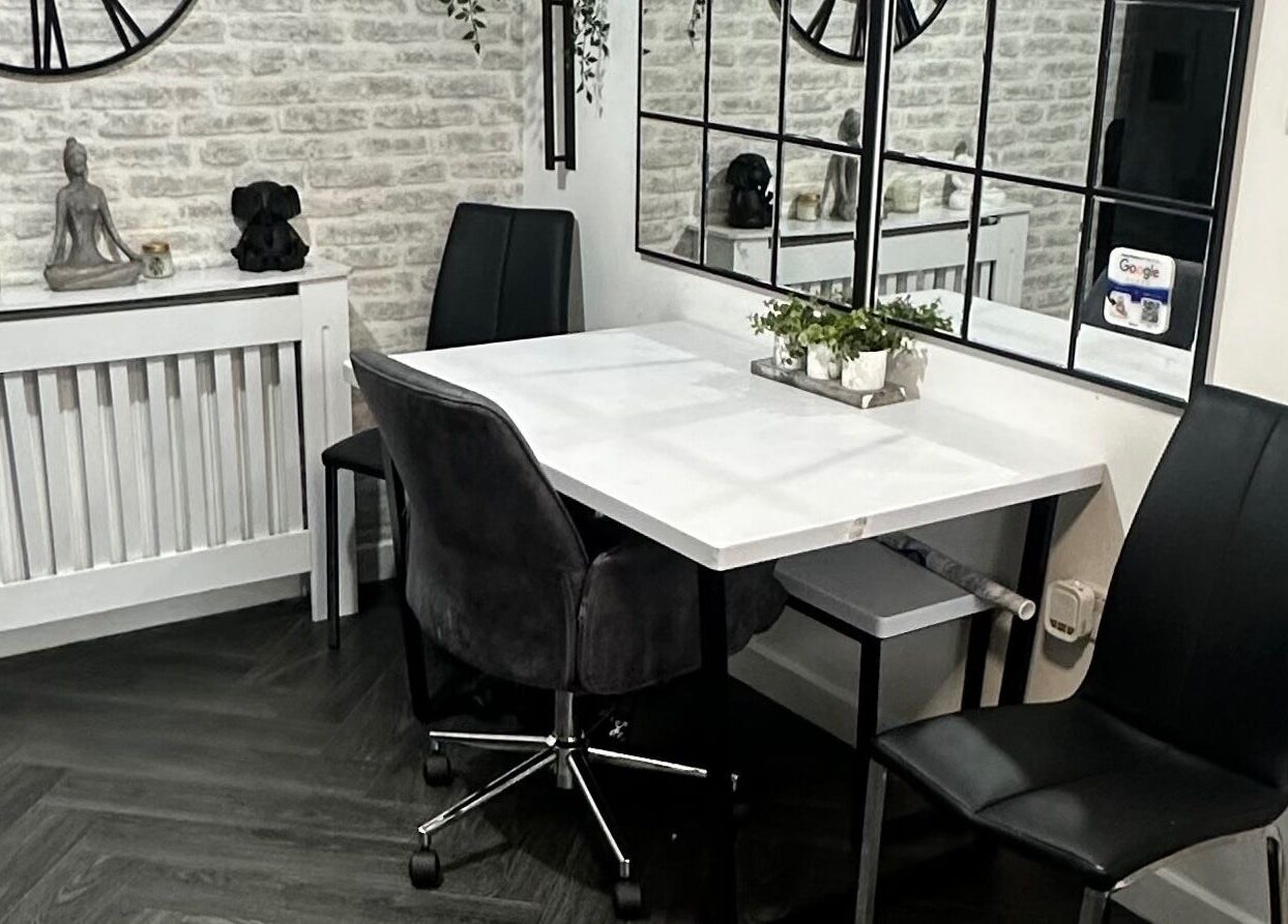 Modern waiting area at Hair To Dye For, Luton, England, GB with chic decor and comfortable seating.