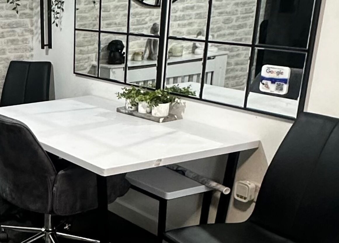 Modern waiting area with sleek chairs at Hair To Dye For in Luton, England, GB.